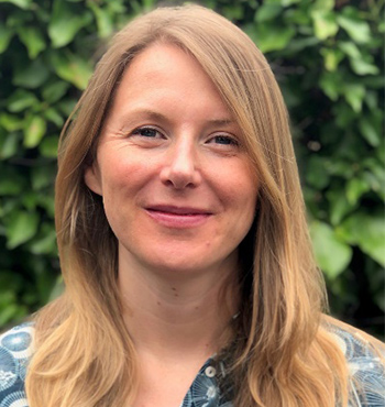 A formal head and shoulder photo of trustee Jessica Craven smiling into the camera