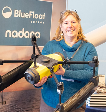 Dr Julie Watson holding a scientific drone