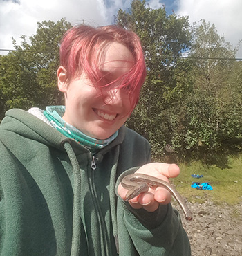 Artemis Eales wearing a green hoodie