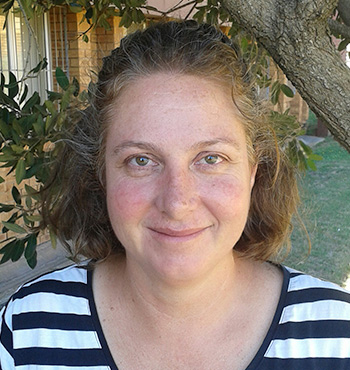 Dr Bernadette Snow standing outdoors, head and shoulder shot.