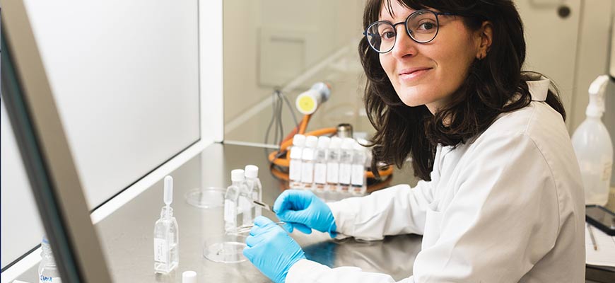 A female postgraduate student working in a lab