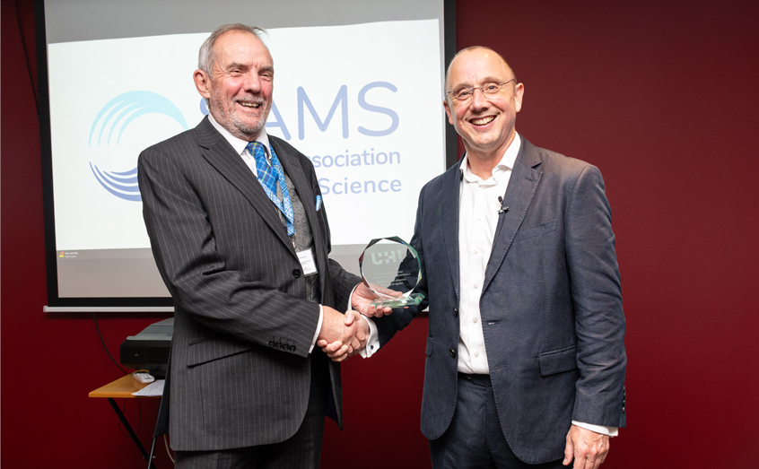 SAMS Director Professor Nick Owens, left, hands over the professorial award to Adam Hughes, Professor of Innovation in the Blue Economy