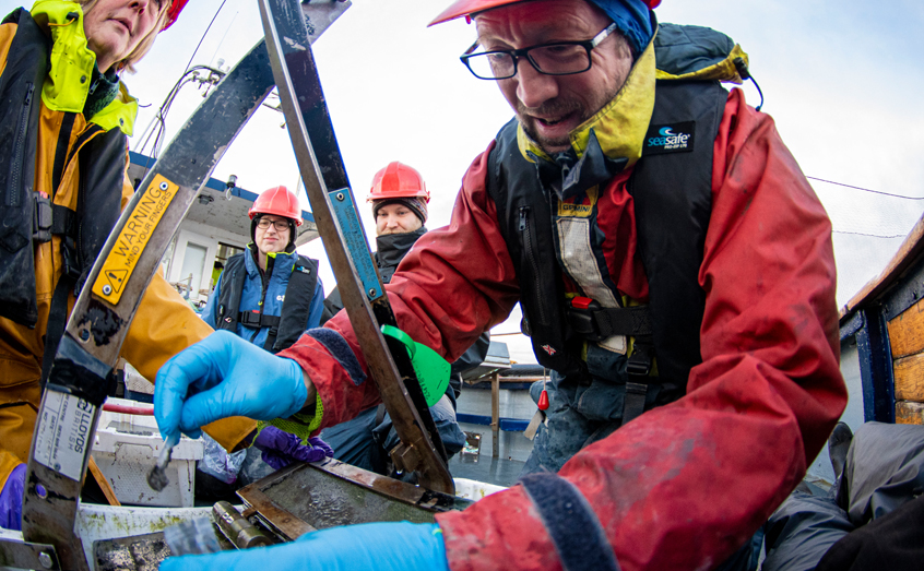 SAMS scientist Prof. Tom Wilding takes a sediment sample for analysis